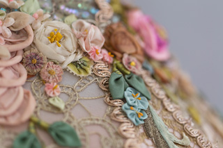 close up of antique silk ribbon work flowers